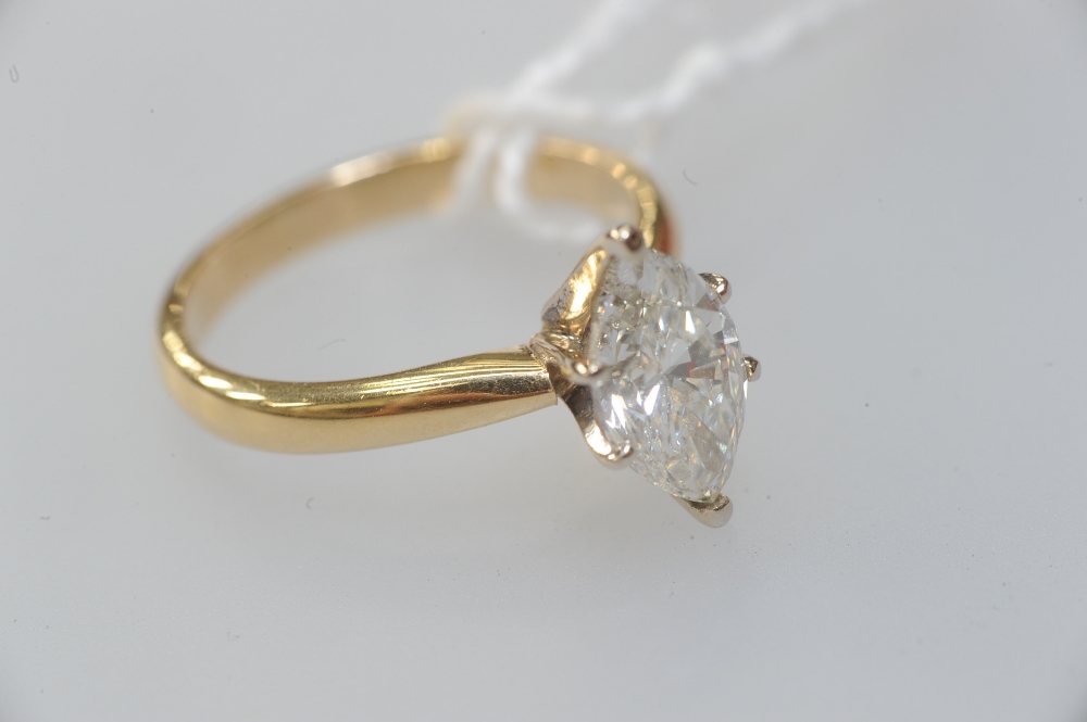 A diamond solitaire ring, the marquise-cut diamond weighing approx. 1.5 carats, claw set on an (