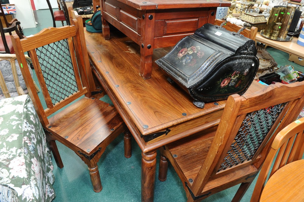 A stained pine dining table and six chairs