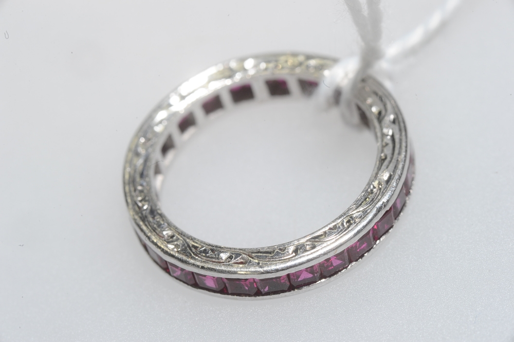 A ruby eternity ring, set in 9ct white gold. Ring size K