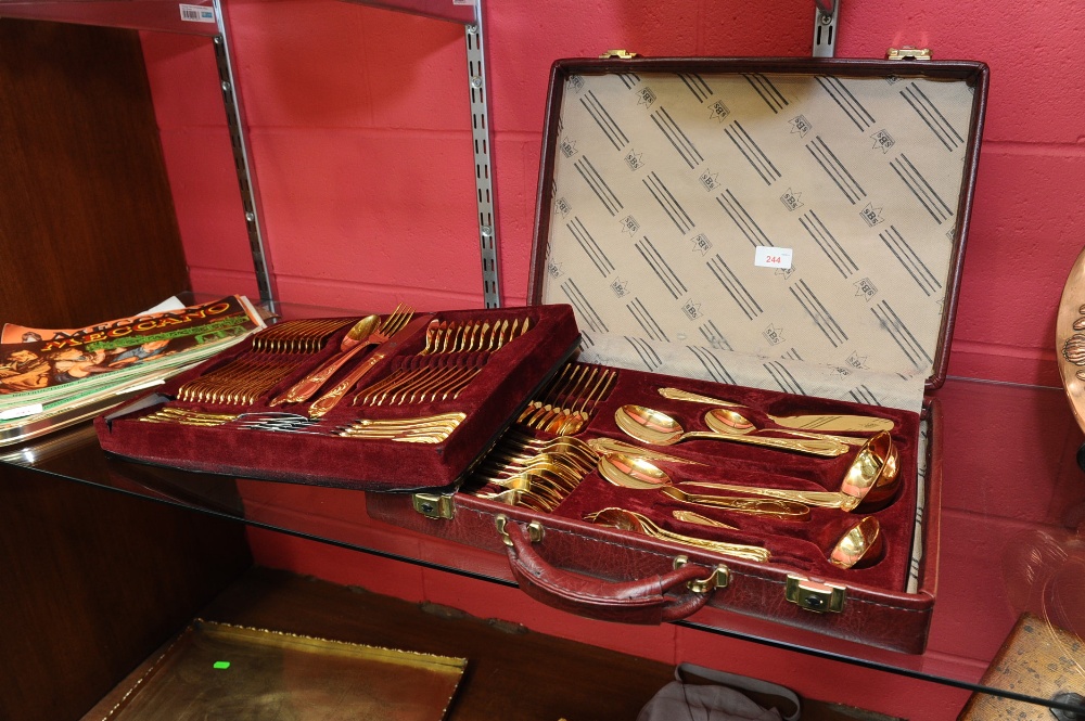 A German gold-plated canteen of flatware in fitted carrying case.