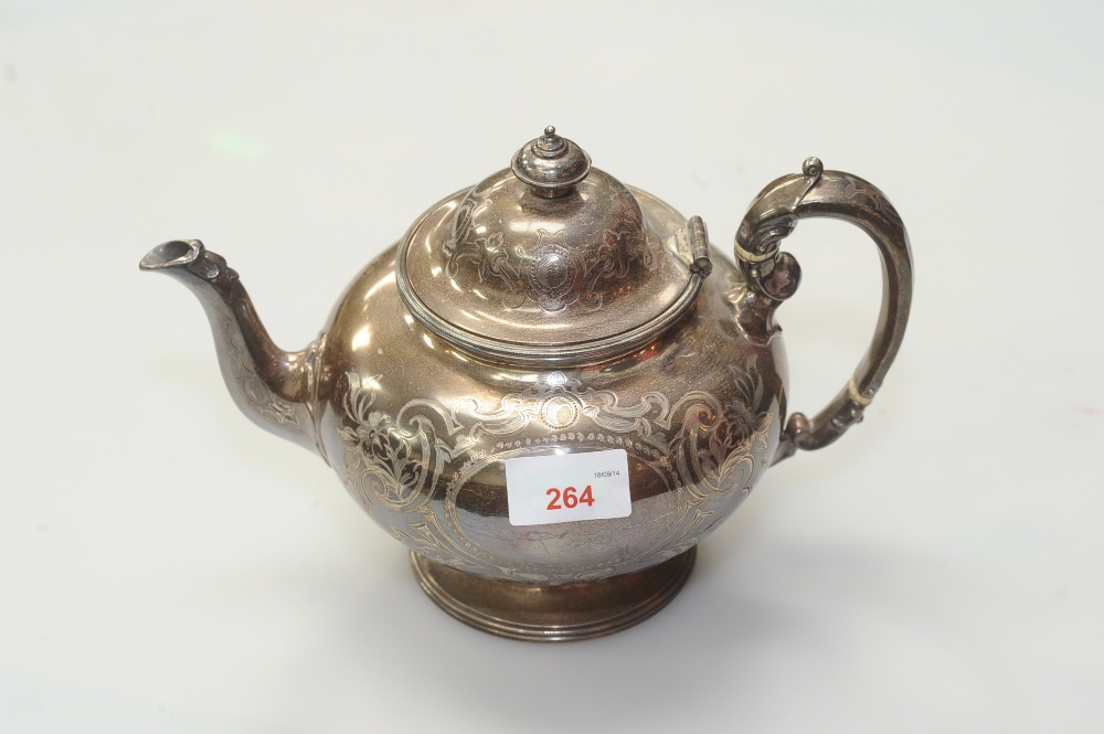 A Victorian silver teapot, Henry Holland, London 1866, of squat bulbous form. 23.5 troy ounces