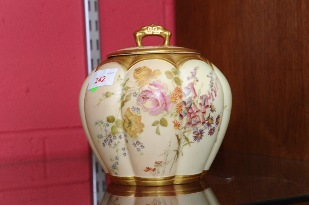 A Royal Worcester blush ivory jar and cover, date code for 1895, of lobed form, painted with roses