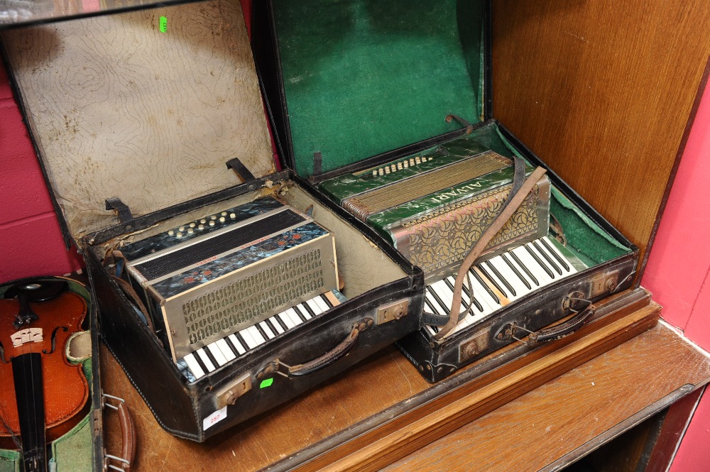Two cased piano accordions, Alvari and Stradella
