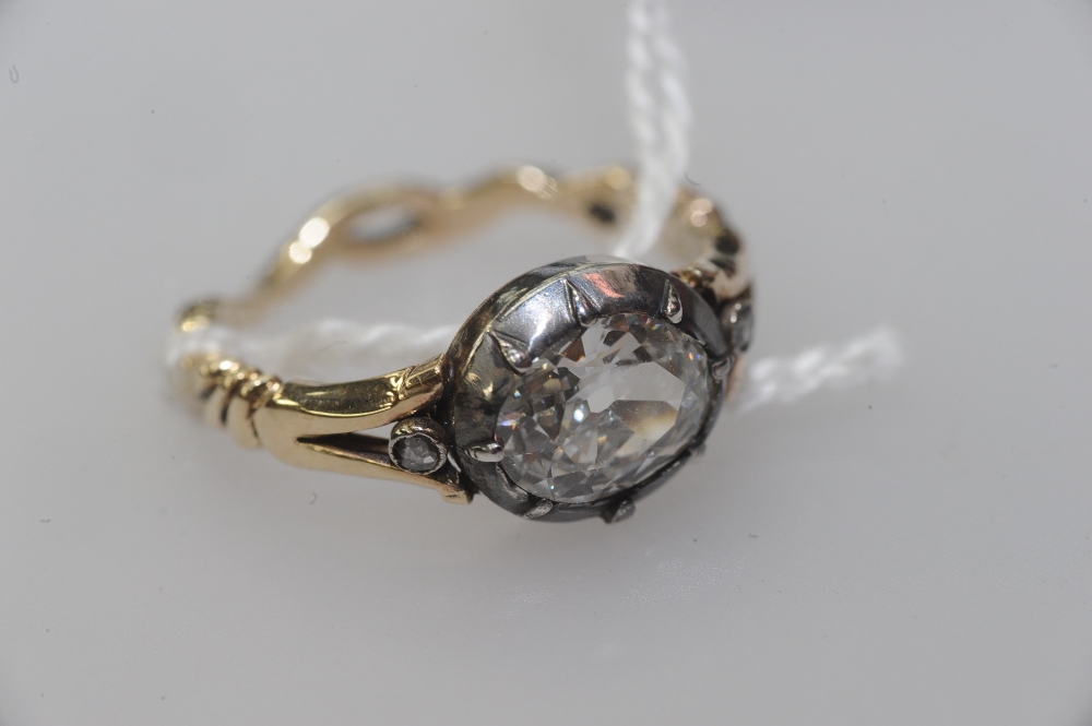 An 18th/early 19th century diamond ring, the large old-cut oval diamond weighing approximately 1.