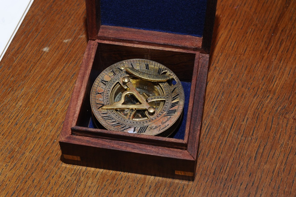 A wooden cased brass compass in period style