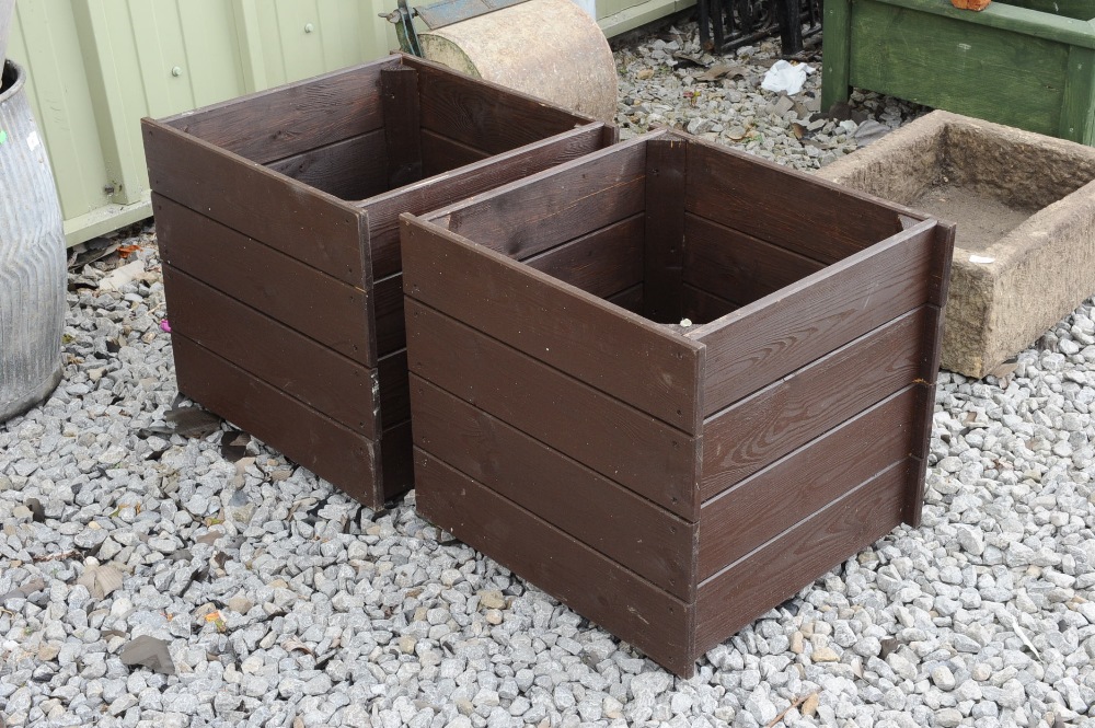 A pair of wooden planters