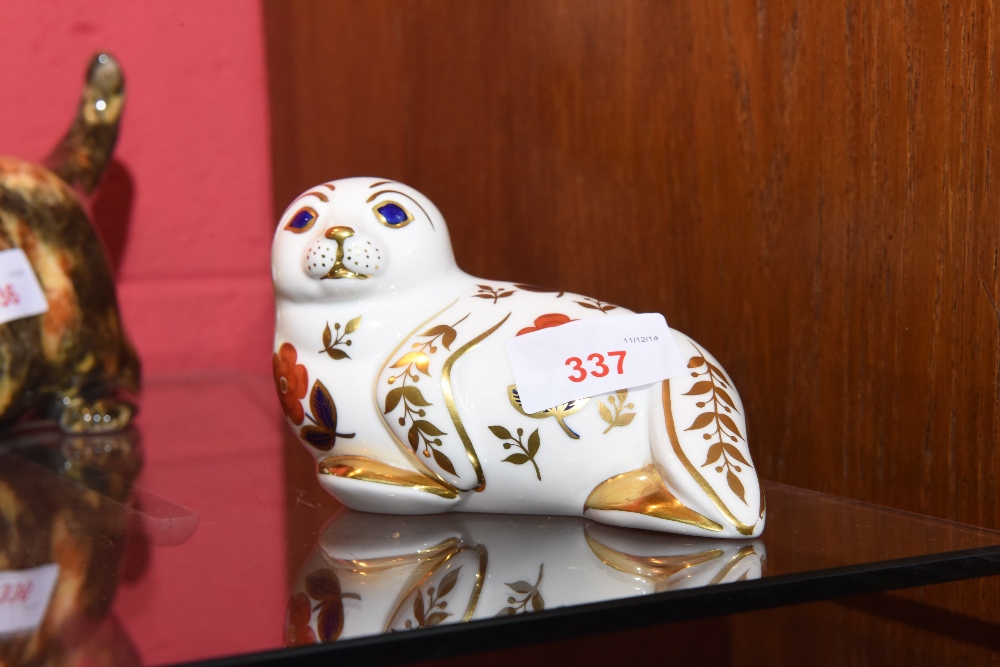 A Royal Crown Derby paperweight of a seal