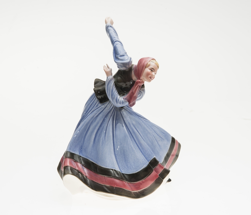 A GERMAN PORCELAIN FIGURE OF A DANCING PEASANT GIRL, IN THE ART DECO TASTE, circa 1930, marked to