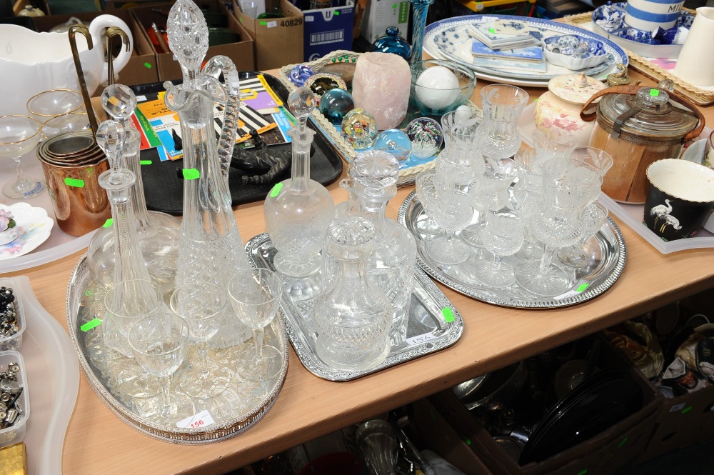 Three trays of 19th century and later glass inc. claret jugs, a suite of etched and cut glass,