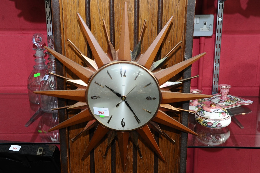 A Metamec sunburst wall clock