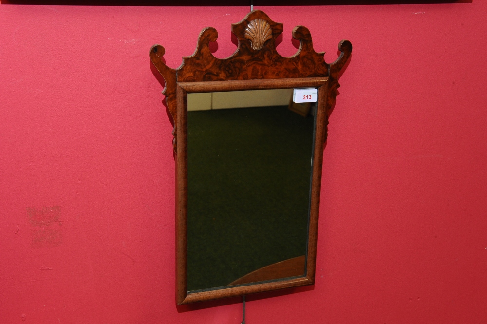 A George III style walnut fretwork mirror