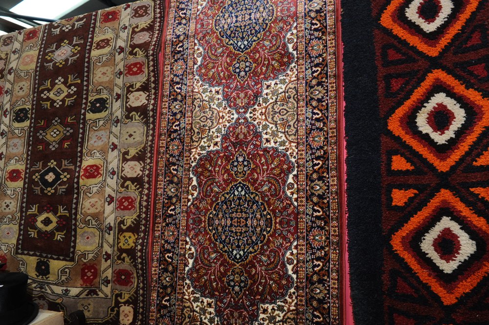 A Kashan style runner with a rose ground, 2.80m x 0.75m