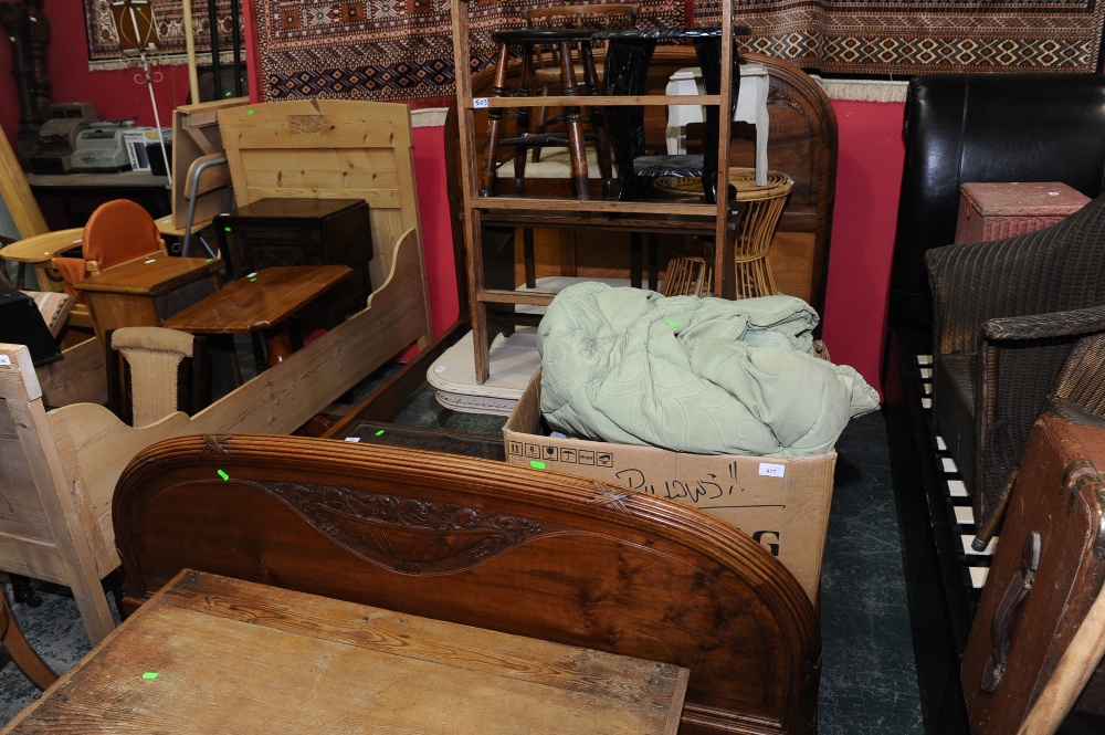 A French 5ft double bed with carved head and footboards