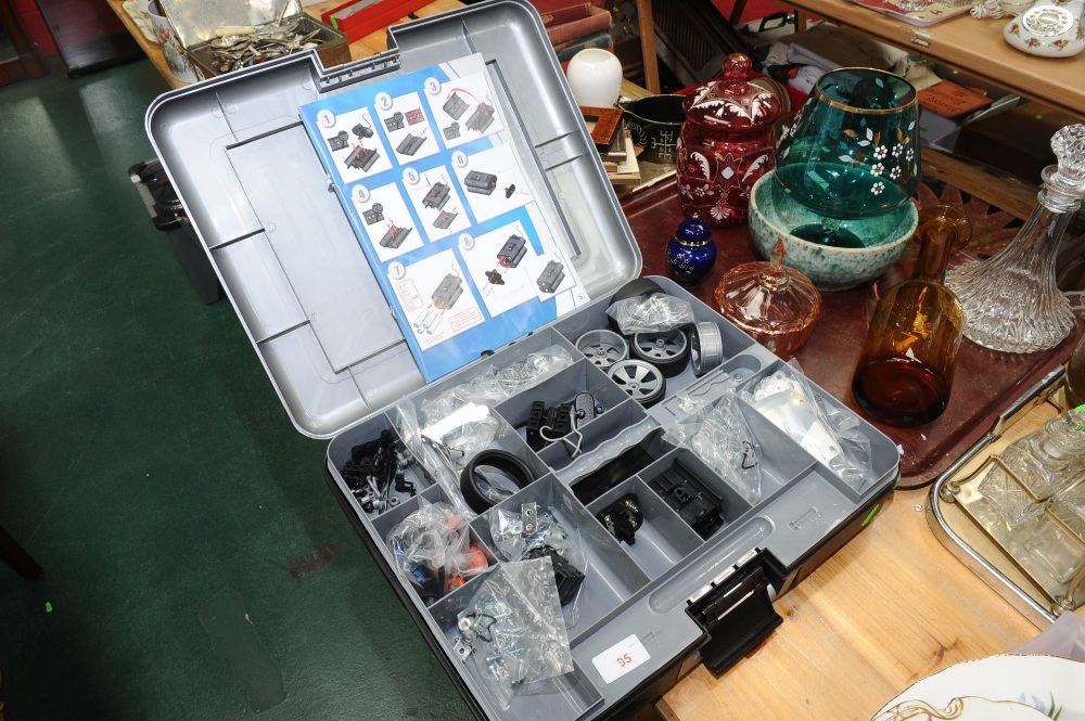 A hard plastic cased meccano set with instruction booklet