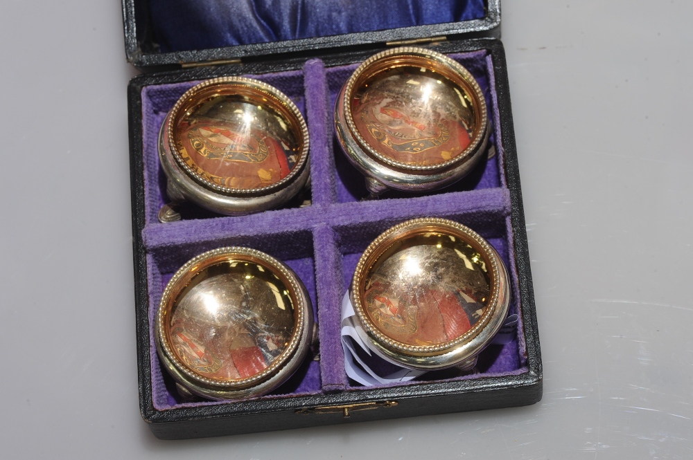 A boxed set of four Victorian silver cauldron shaped salts with beaded rims and on hoof feet, London