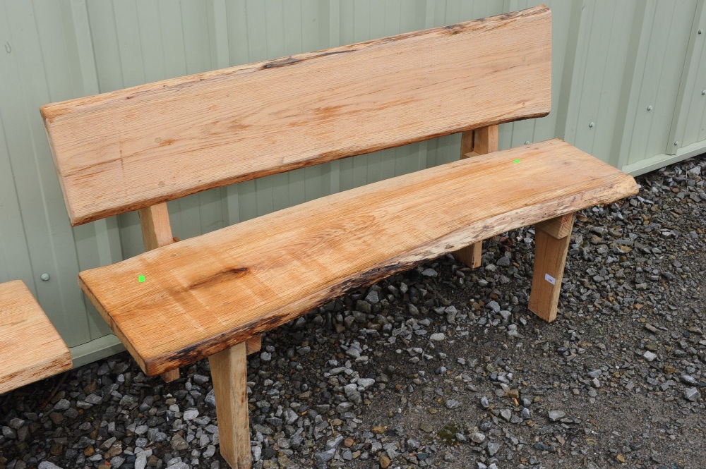 A plank seated and backed oak bench