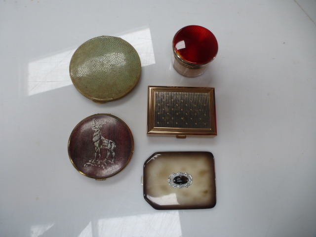 An early 20th century  red enamel and silver topped powder jar together with four early 20th century