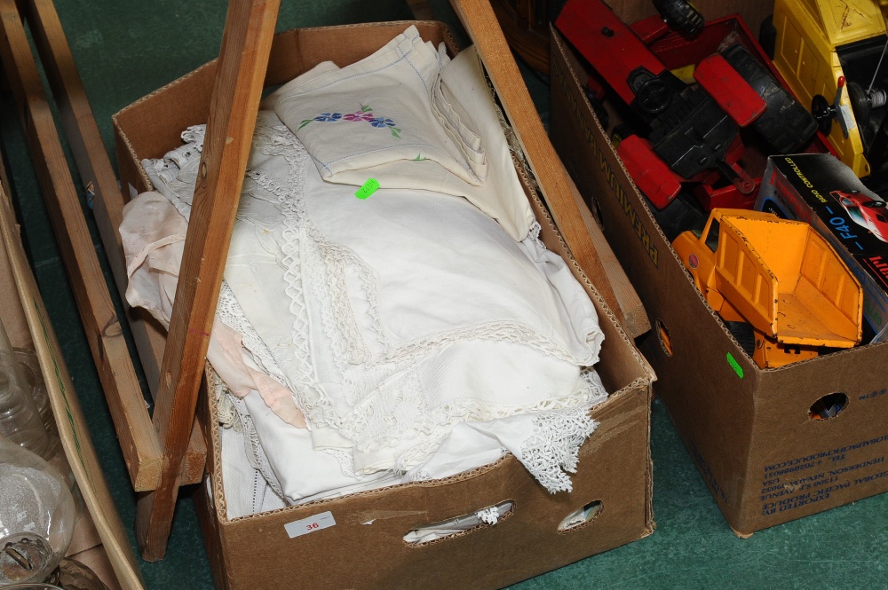 A box of crocheted and embroidered linens