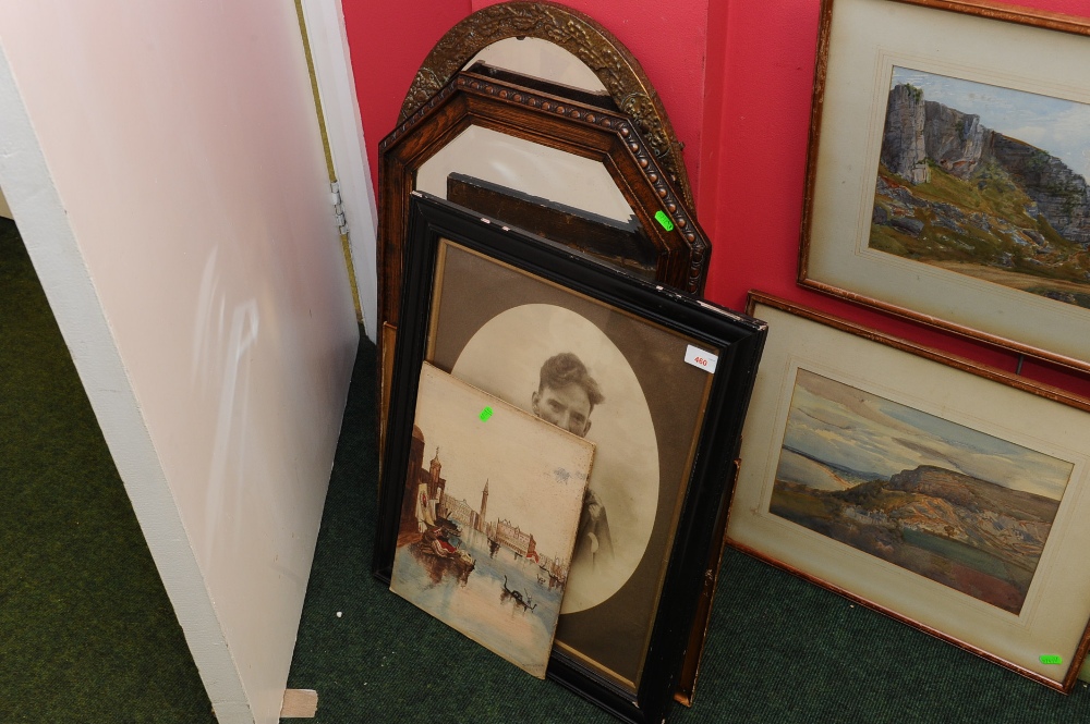 A group of framed pictures and mirrors