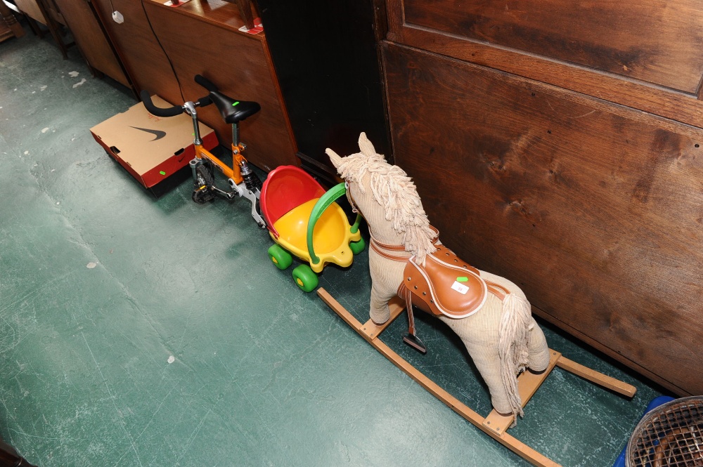 A pair of Nike roller blades, the box signed by David Bellamy; tog. with a rocking horse, doll`s