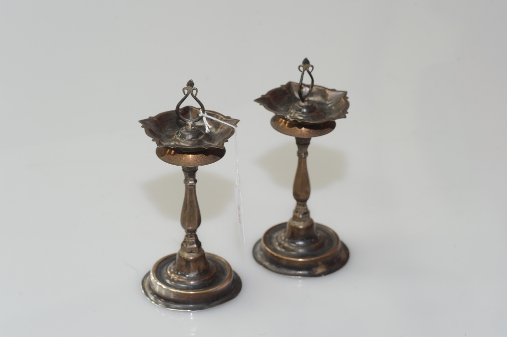 A pair of Continental silver sticks of pricket type, probably 18th century, unmarked. 5 troy ounces