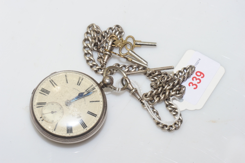 A Victorian silver cased open face pocket watch, London 1859, suspended from a curb link watch chain