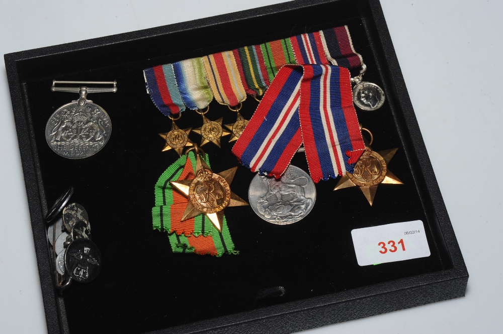 A group of four World War II general service medals including the Defence Medal, 1939-1945 Star