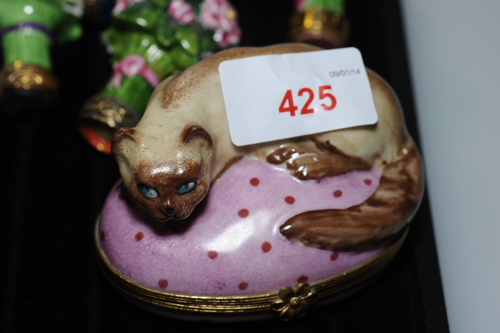 A French enamel box shaped as a cat crouching on a pink cushion, with gilt metal mounts marked Cree,