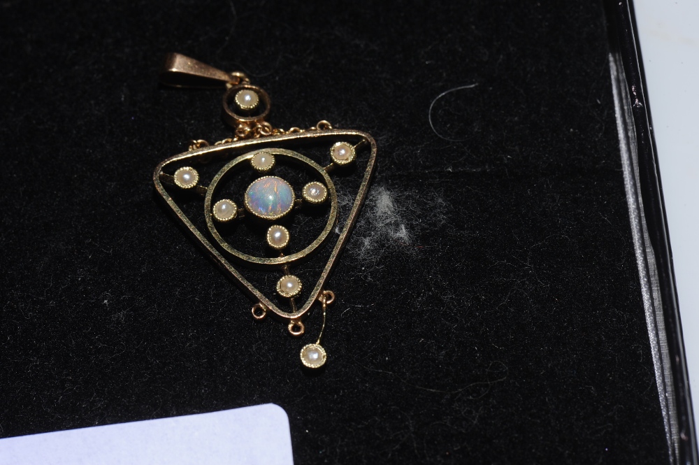An Edwardian 15ct gold pendant set with opals and seed pearls