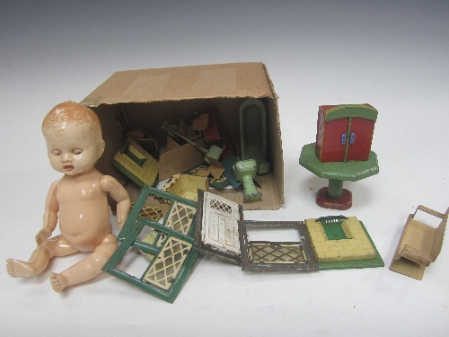 A collection of tinplate painted lead and wooden Doll`s House accessories including windows,