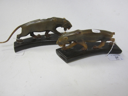 A CARVED HORN MODEL OF A TIGER and a similar model (2).