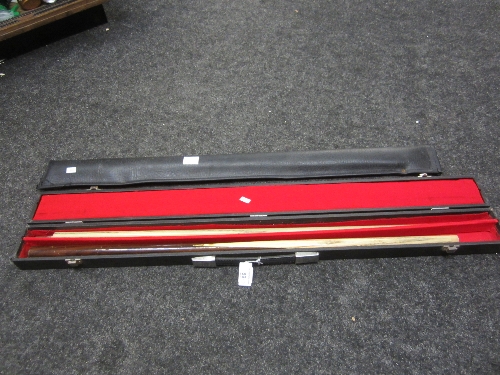 SNOOKER: a Classic Custom ash two section cue, cased and a Riley two section cue, in a soft case. (