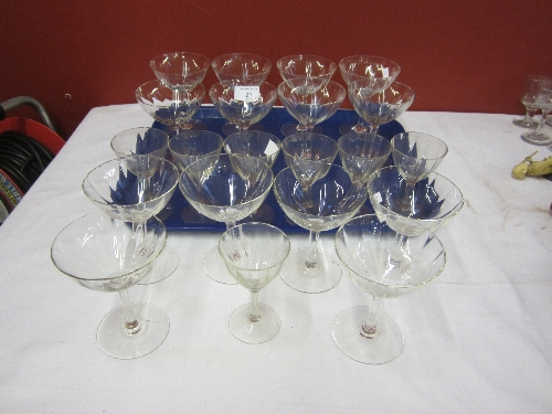 A SET OF FOURTEEN CHAMPAGNE GLASSES, shallow slightly lobed bowls, 12cm. and seven similar Sherry