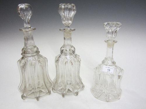 A PAIR OF VICTORIAN MOULDED GLASS DECANTERS, ribbed form, double ring necks, matched stoppers, 57cm.