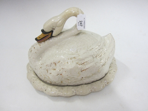 A STAFFORDSHIRE NOVELTY CHEESE DISH, modelled as a swan, gilt and enamel decoration, 22cm.