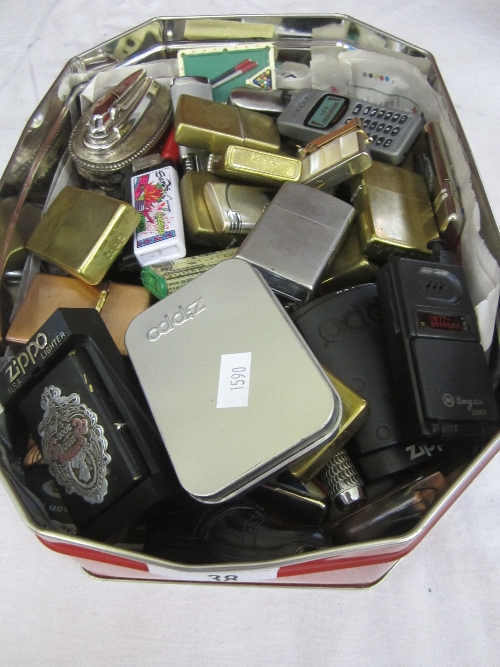 A COLLECTION OF NOVELTY CIGARETTE LIGHTERS and other lighters.