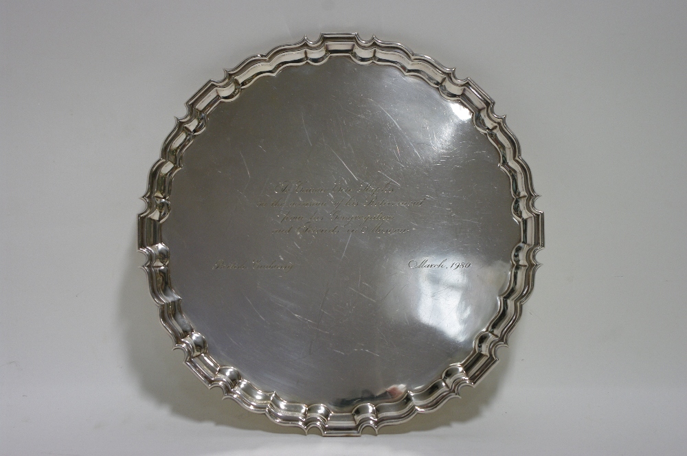 A 12¼"" dim. salver with Chippendale border, engraved presentation inscription, & on four paw feet;