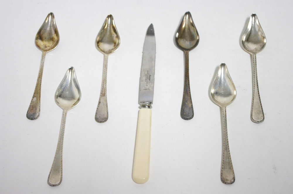 A set of six feather-edge grapefruit spoons, Sheffield 1961 by Payne & Son; together with an ivory-