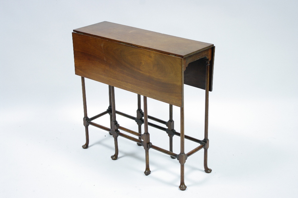 A George III style mahogany ?spider-leg? table with drop leaves to the rectangular top, on slender