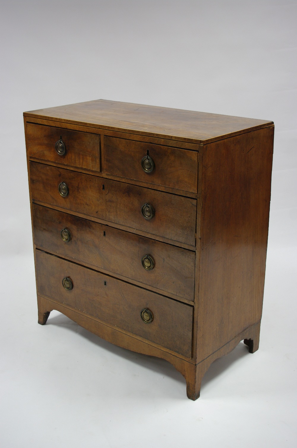 An early 19th century mahogany chest fitted two short & three long graduated drawers with brass