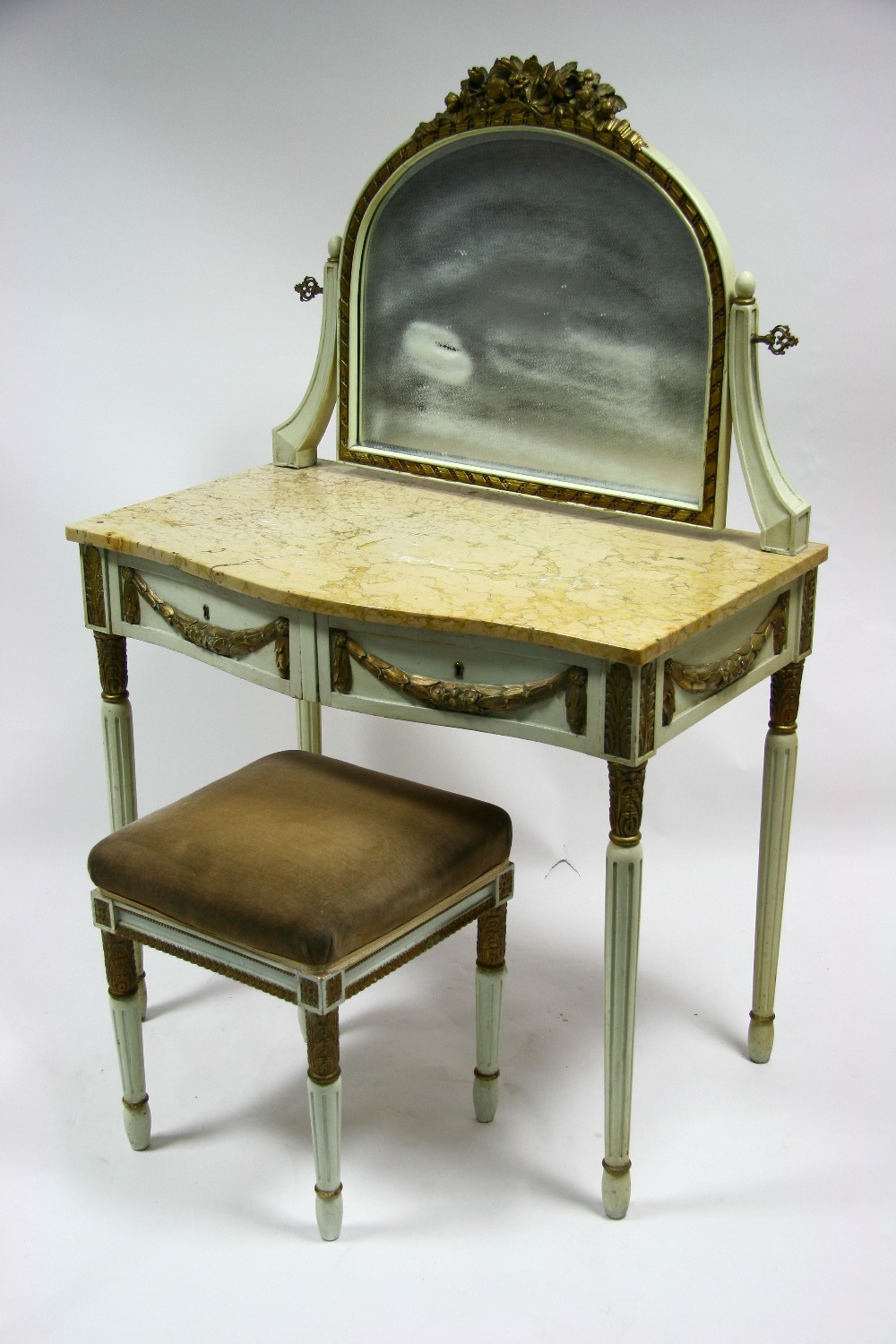 A French neo-classical style painted & gilt dressing table with swing mirror, serpentine-front