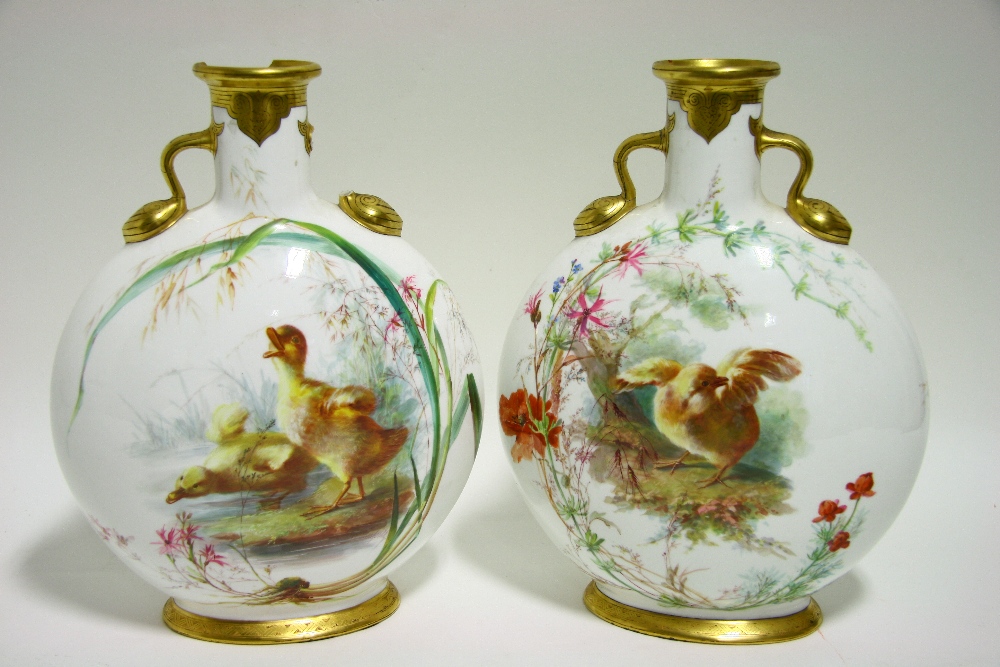 A PAIR OF MINTONS PORCELAIN MOON FLASKS with finely painted scenes of chicks & ducklings by WILLIAM