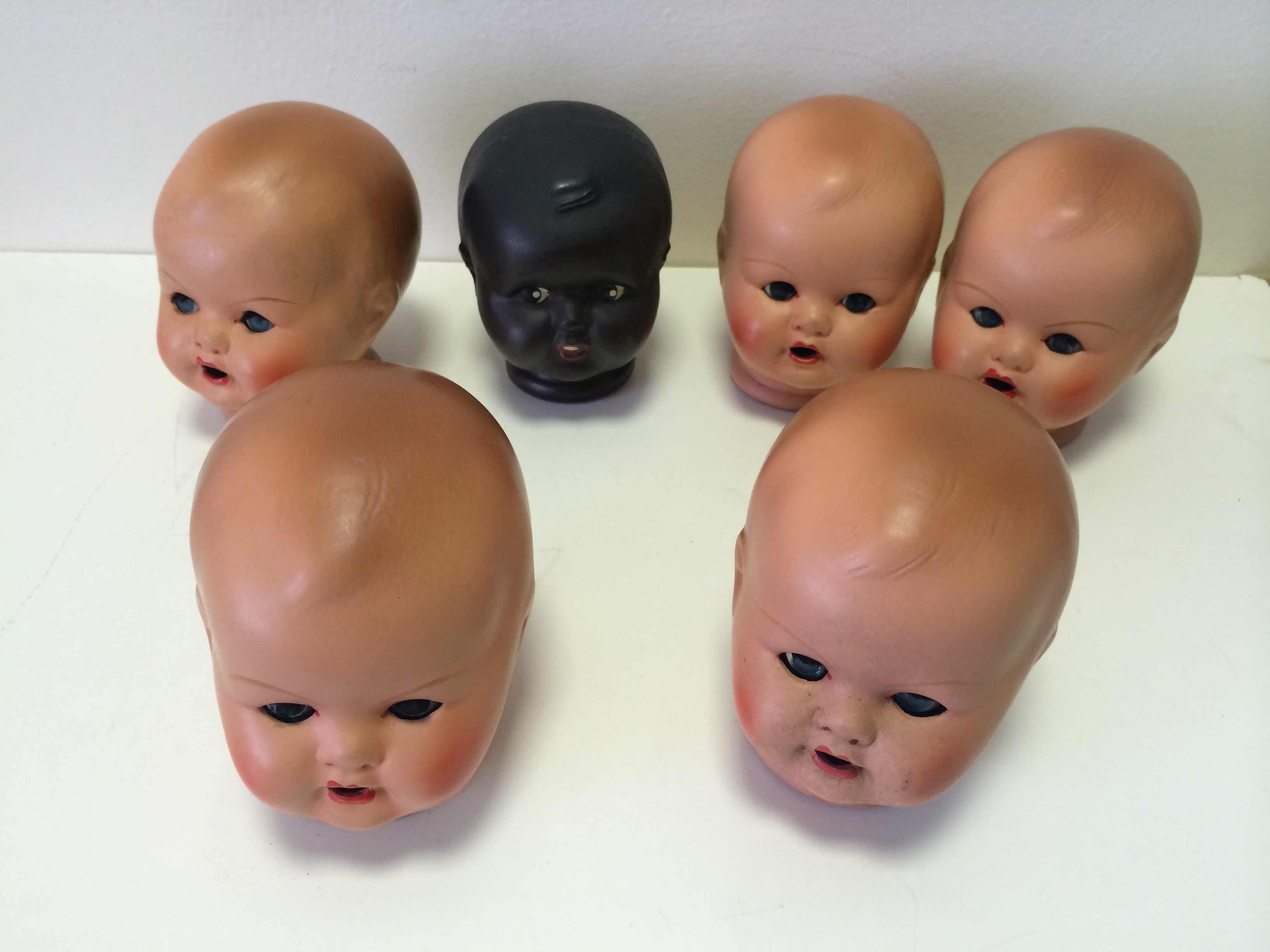 Box of 6 dolls heads - some marked HS at rear.