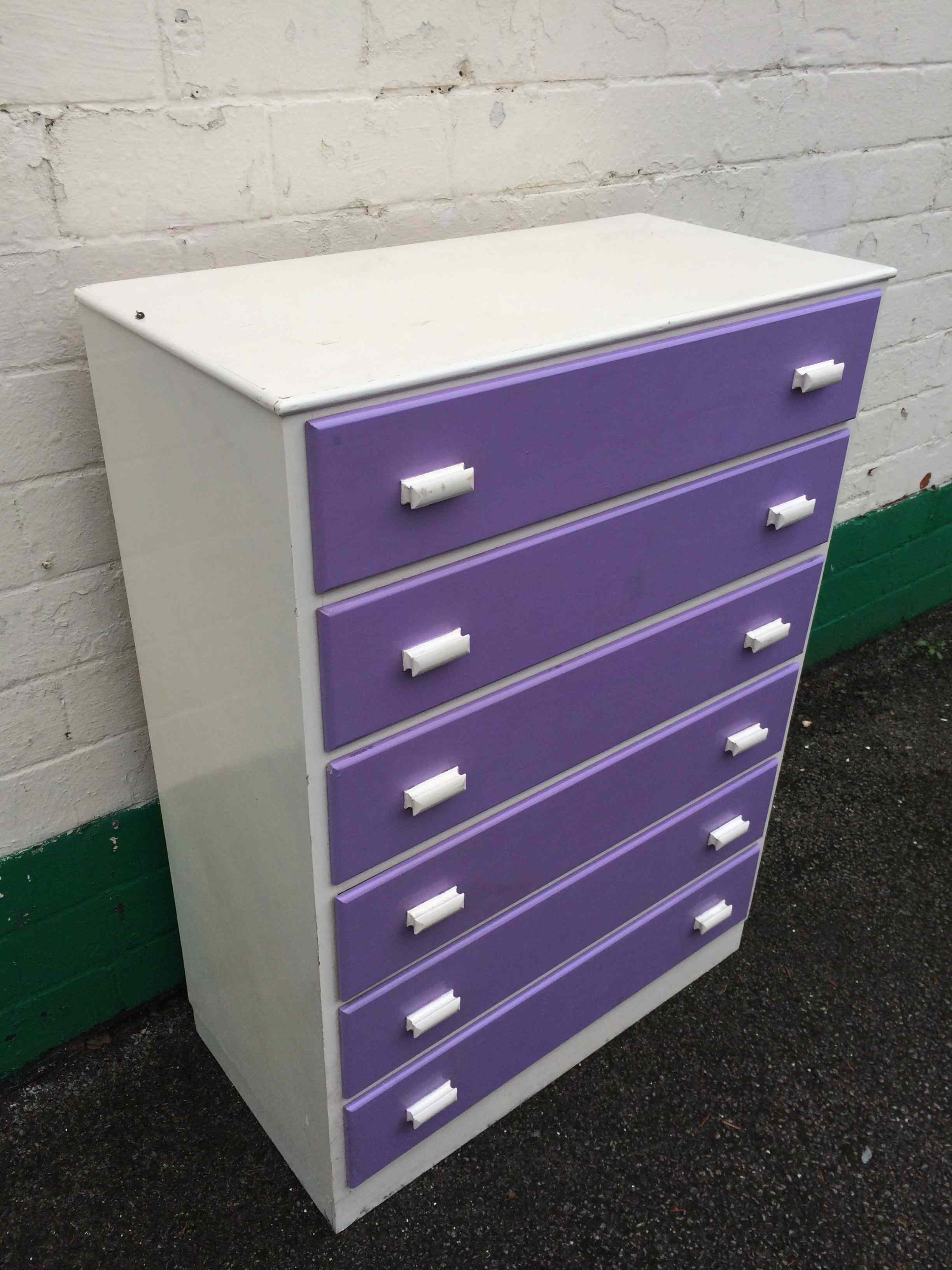Set of painted purple and white upcycled drawers in the shabby, vintage chic style.