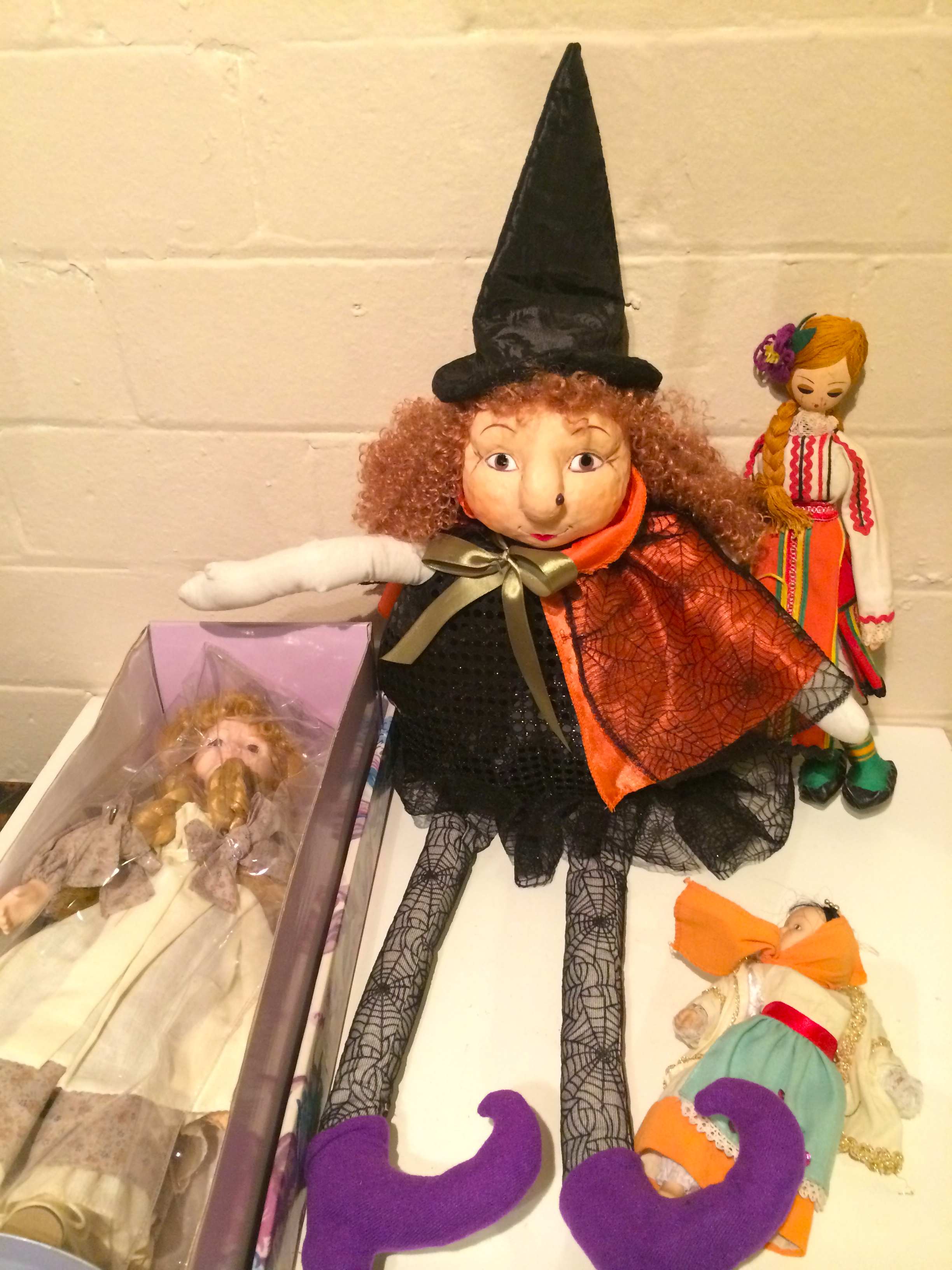 Large fabric witch, plus two dolls.