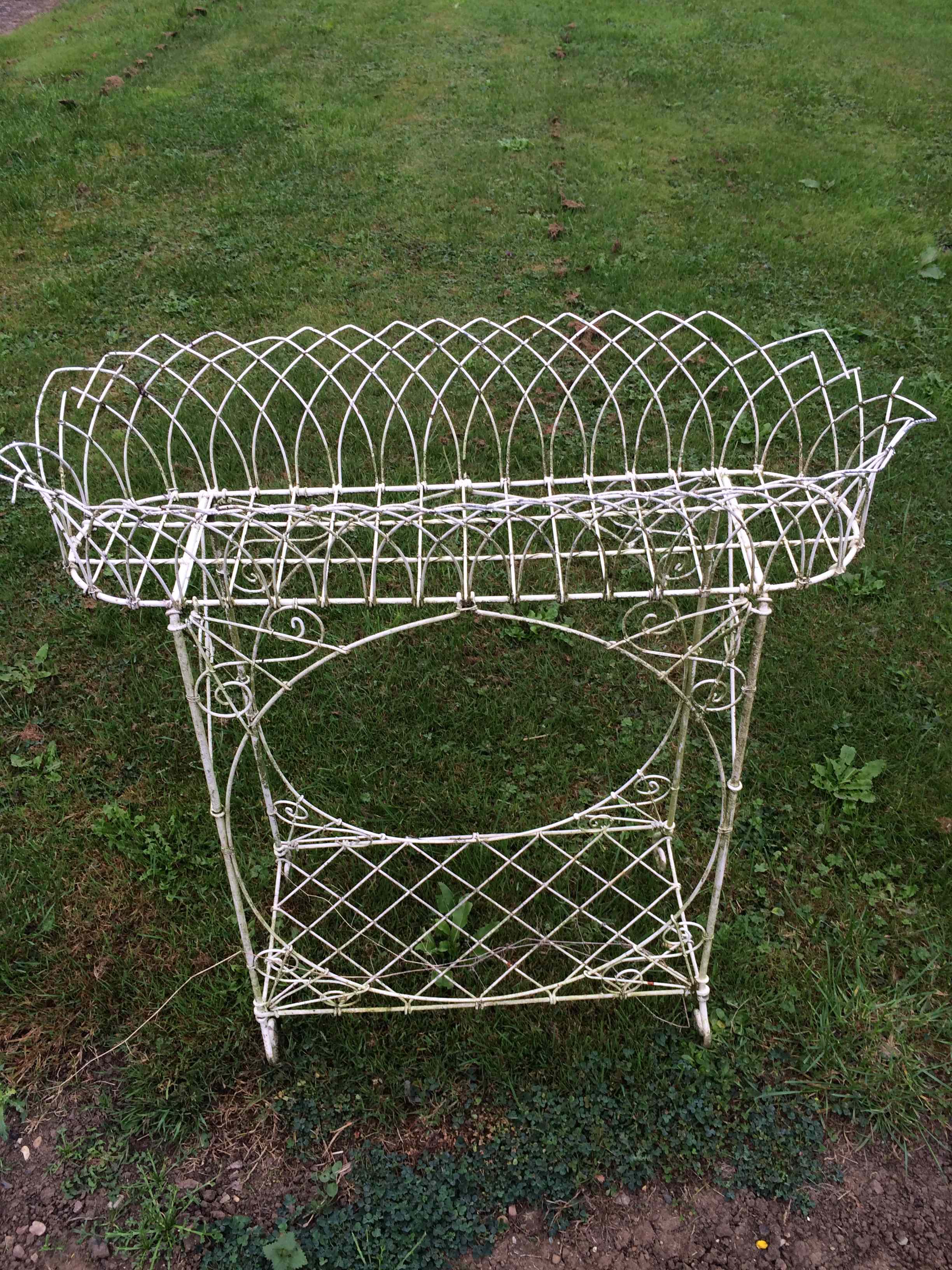 Victorian wirework plant holder garden ornament.