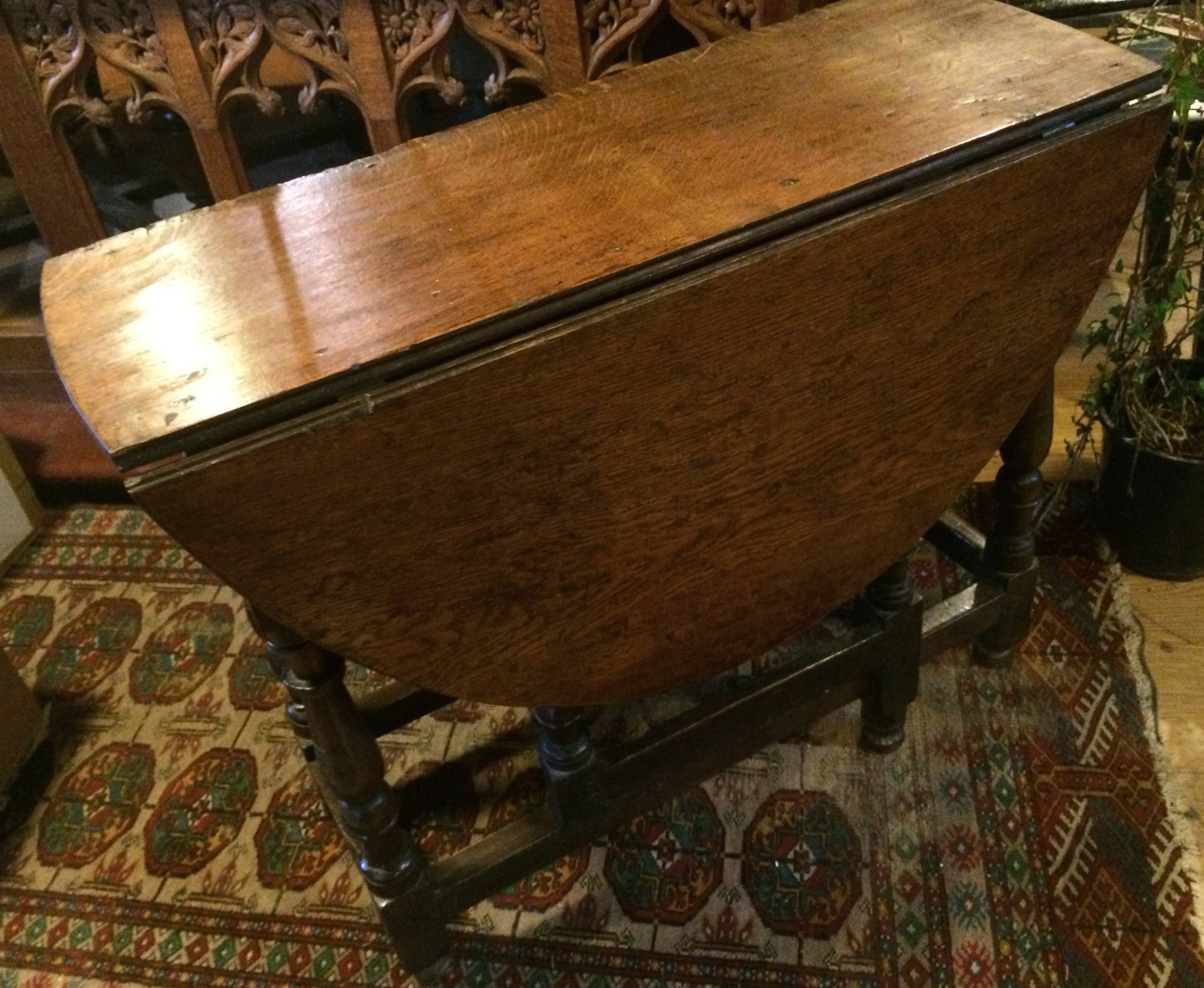 An 18thC gate leg drop leaf table with the legs possibly being earlier.