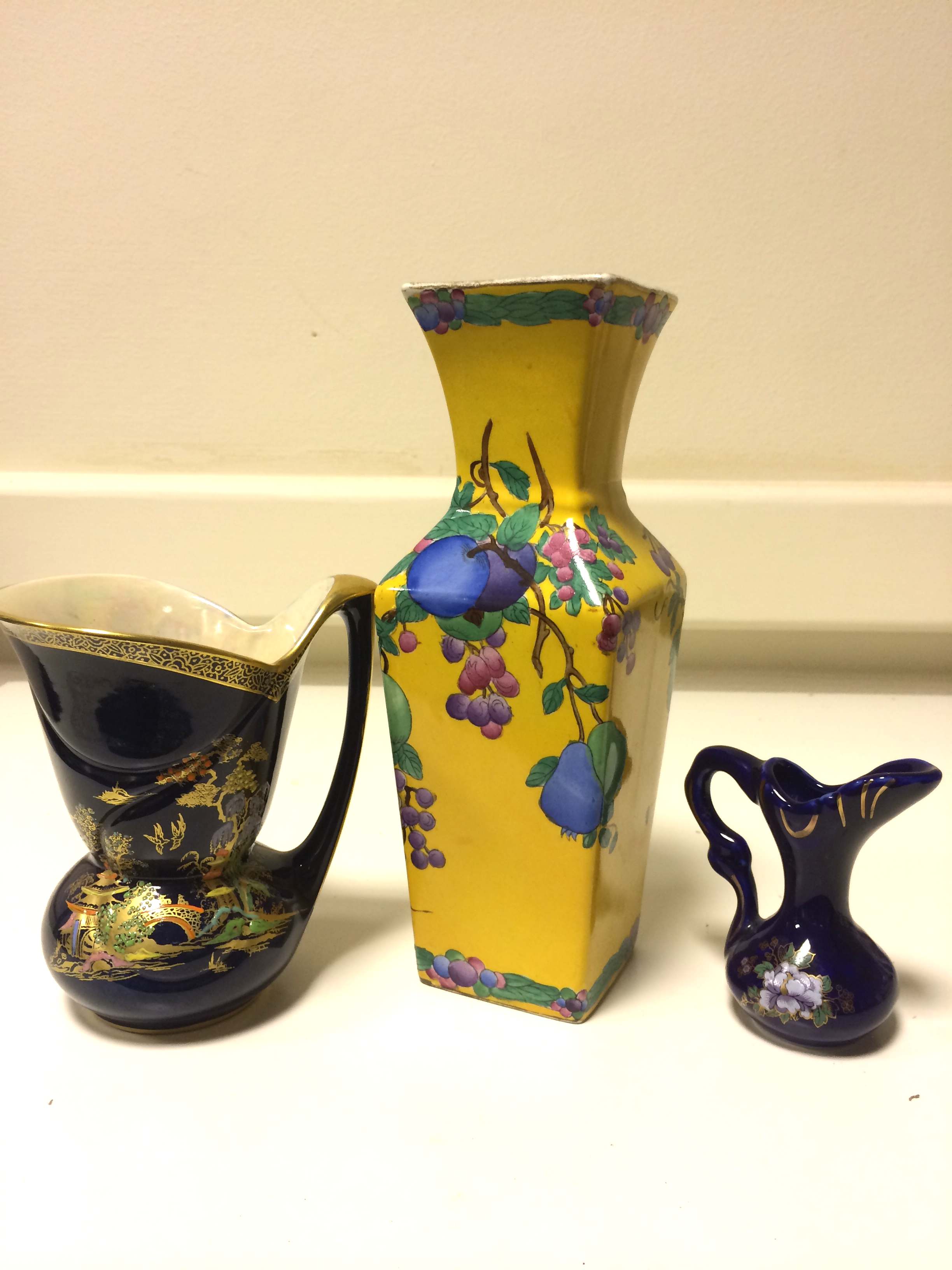 3 Oriental design pieces including a decorative vase and 2 jugs, one being Crown Devon. (3)