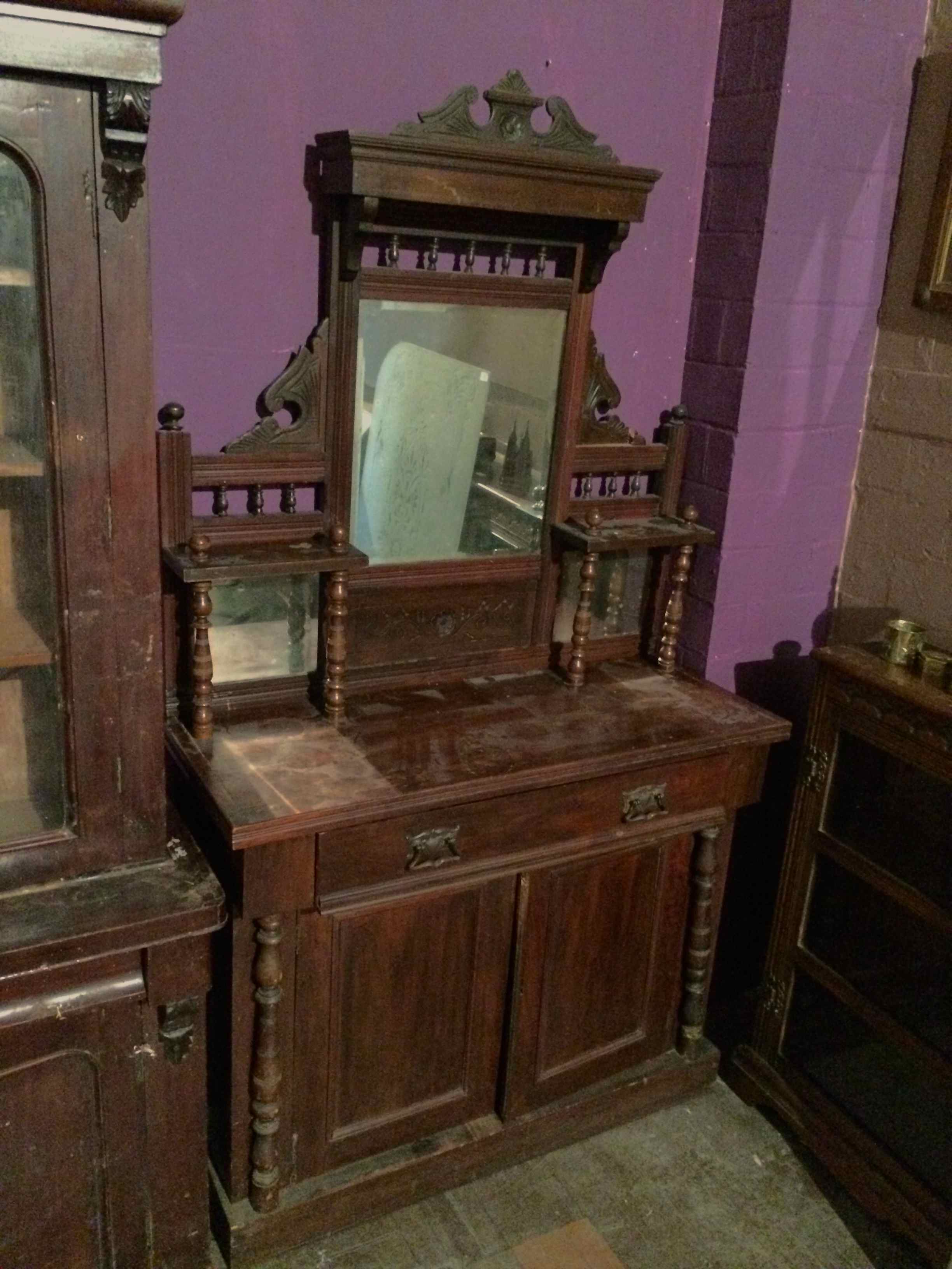 Chiffonier Cir 1900 with turned spindles and shelves.
