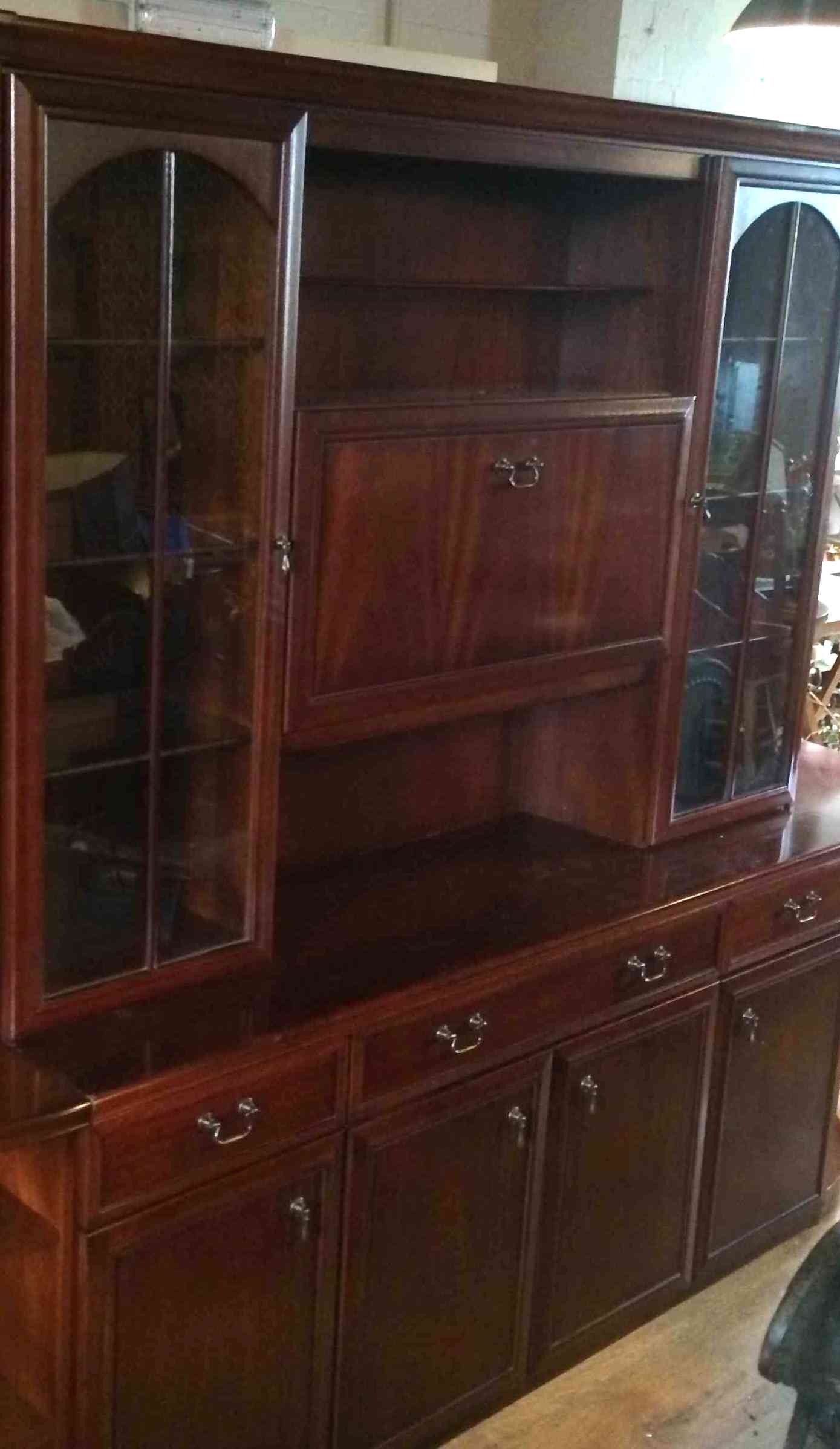 Large Mahogany room display unit with glass doors, cupboards and shelves.